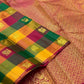 Folded multicolour Paalum Pazhamum Kanchipuram saree with checked silk squares and gold zari temple motifs.