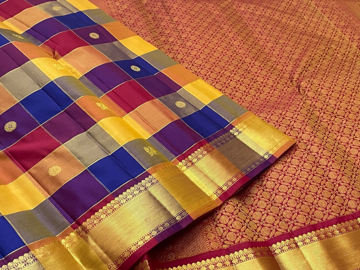 Multicolour pure silk Kanjivaram Paalum Pazhamum saree with blue purple mustard and rust woven checks.