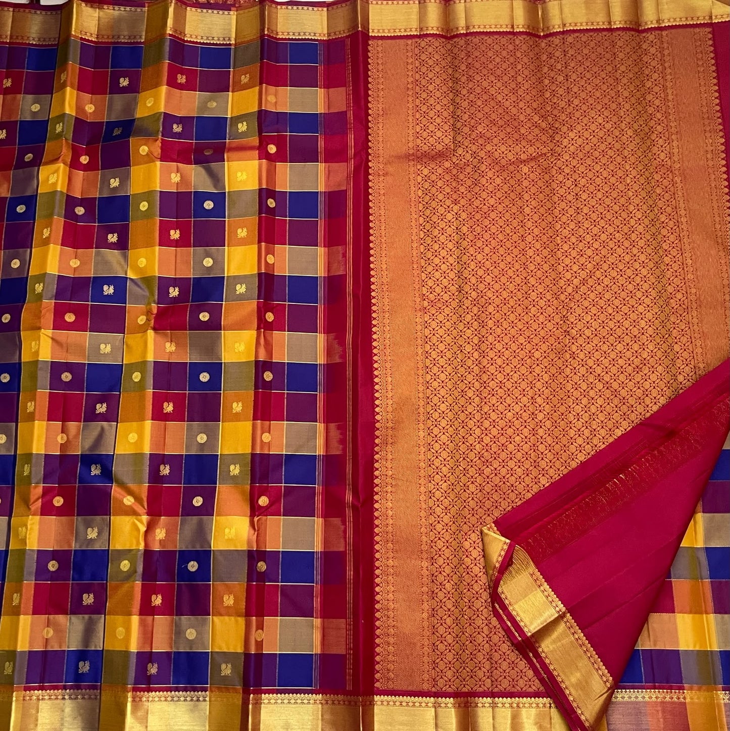 Multicolour checked pure silk saree with mustard raspberry copper and blue woven blocks.