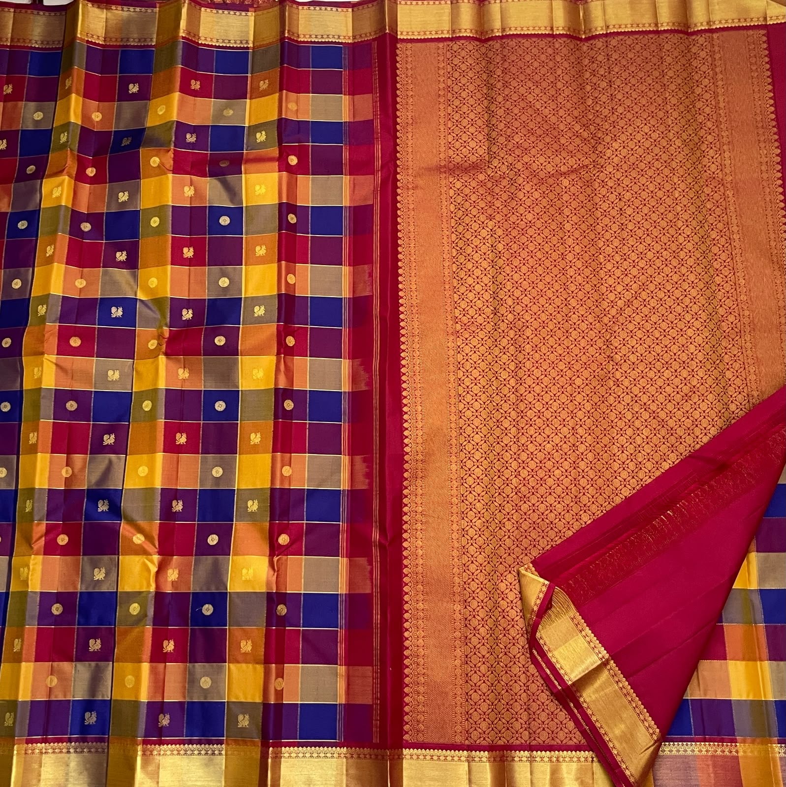 Multicolour checked pure silk saree with mustard raspberry copper and blue woven blocks.