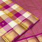 Handwoven Paalum Pazhamum Kanchipuram silk saree with multicolour checked body and antique-gold zari motifs.