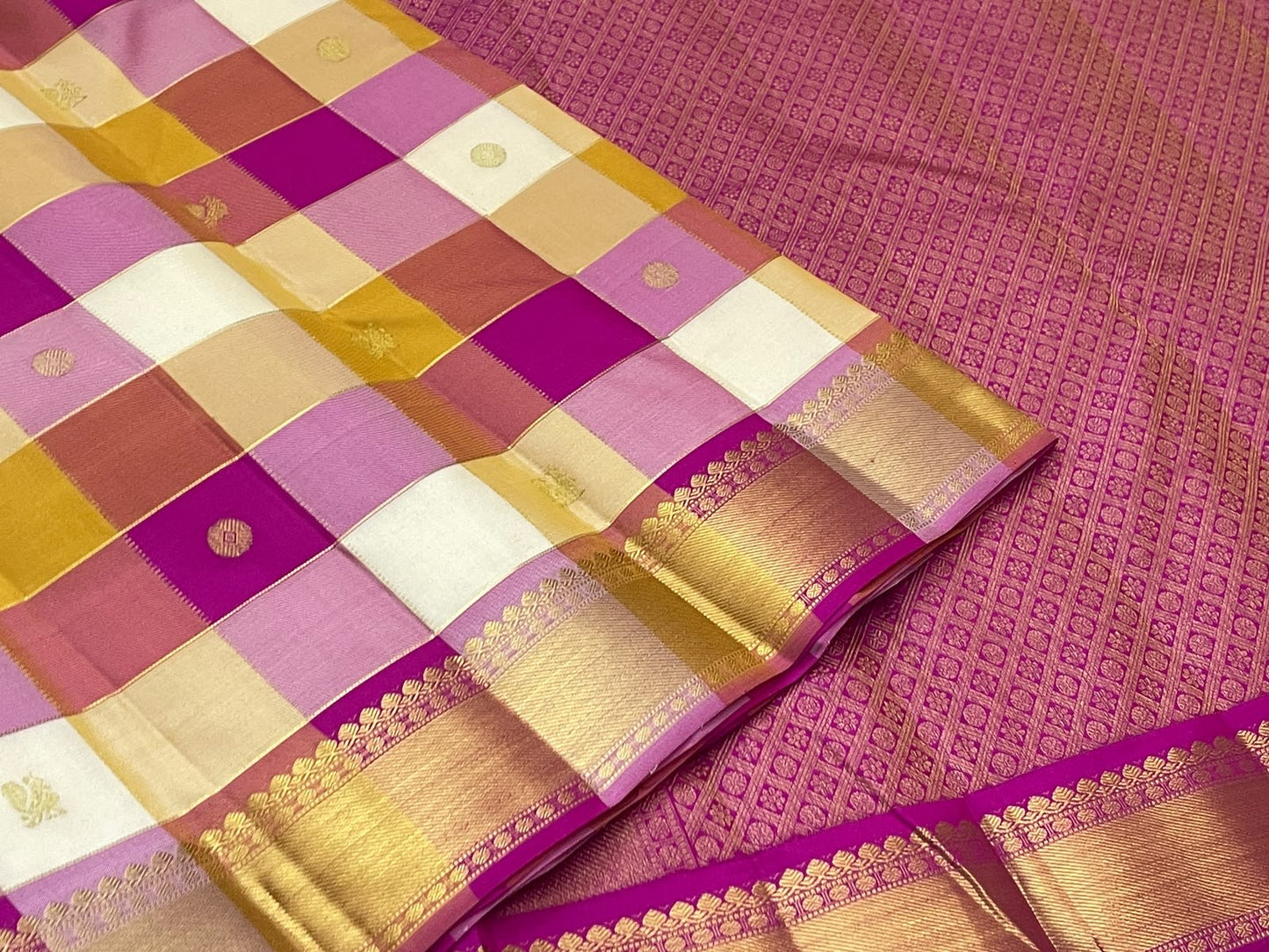 Handwoven Paalum Pazhamum Kanchipuram silk saree with multicolour checked body and antique-gold zari motifs.