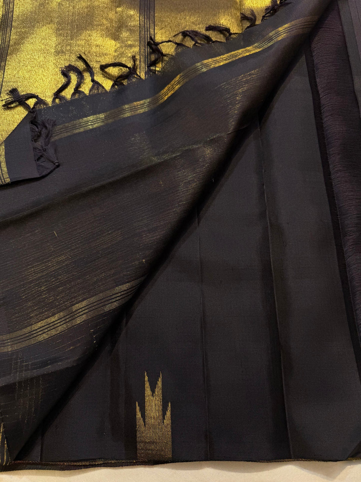 Multicolour temple border on black Kanjivaram saree