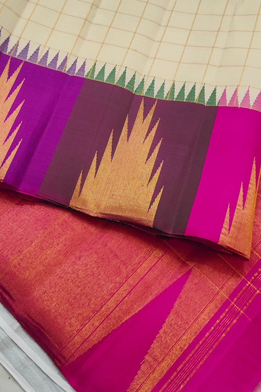 Warm Ivory pure mulberry silk saree with fine gold check pattern and rich multicolour Kanchipuram border.