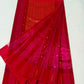 Close-up of the Muniya-style hand-painted border detail with green accents on a Rani Pink Tissue Silk Chanderi saree