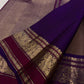 Taupe Kanchipuram silk saree with spaced gold zari buttas and richly woven purple Varisaipet border.