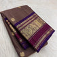 Mushroom Taupe pure mulberry silk saree with small gold buttas and traditional purple zari border.