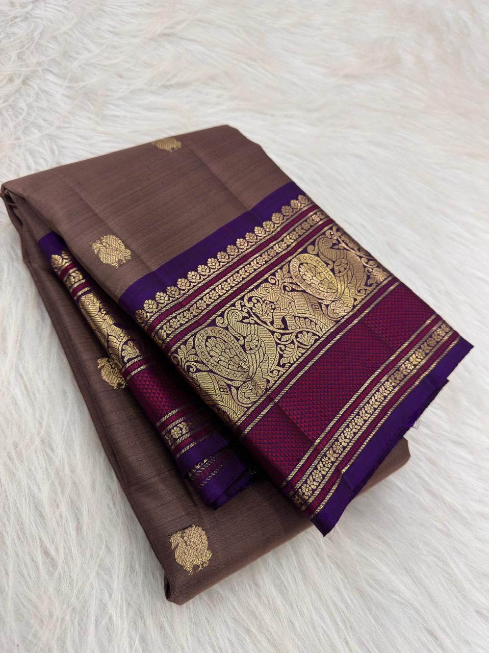 Mushroom Taupe pure mulberry silk saree with small gold buttas and traditional purple zari border.