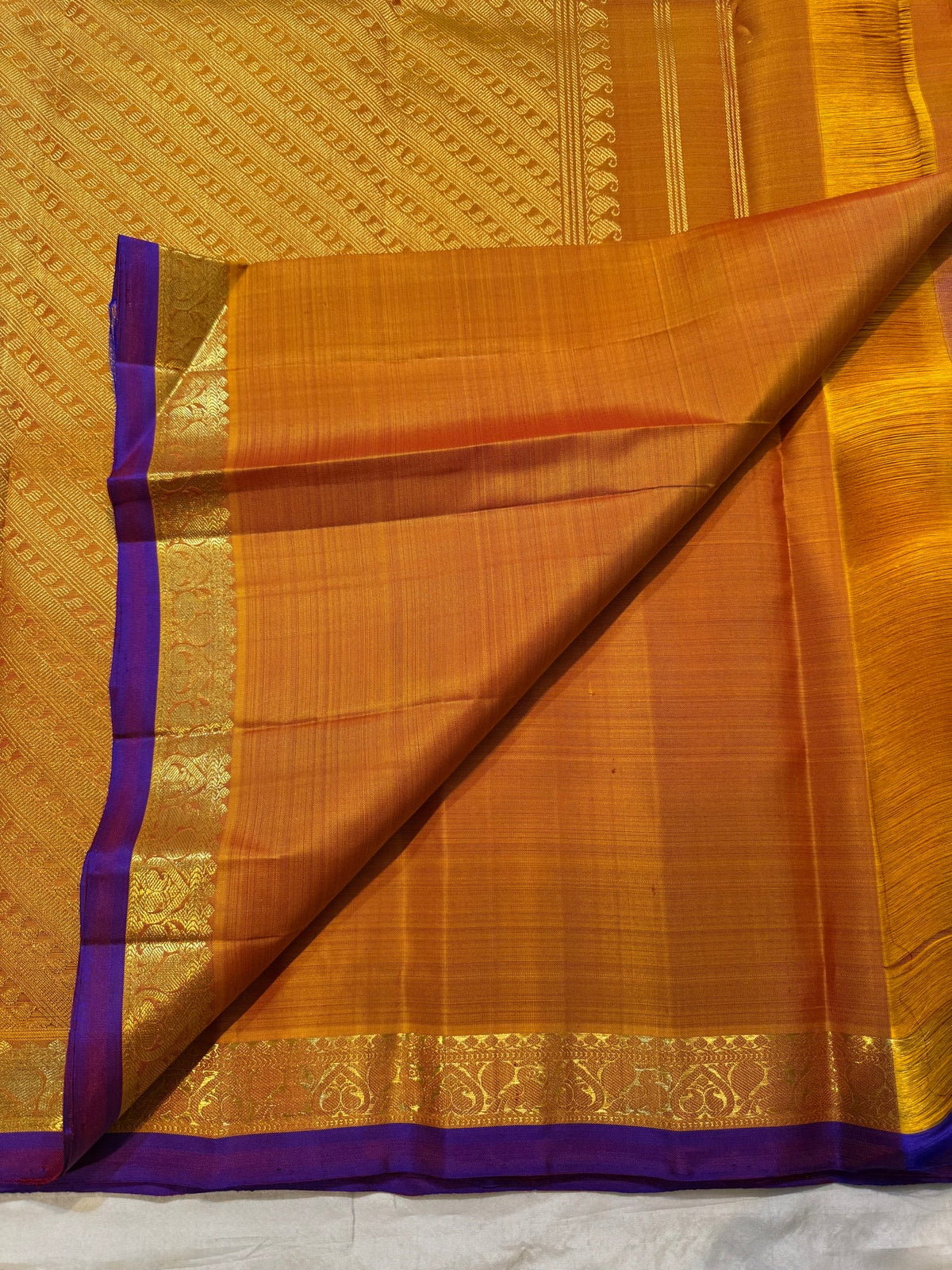 Handwoven Butta saree with traditional antique-gold zari border and Deep Purple selvedge.