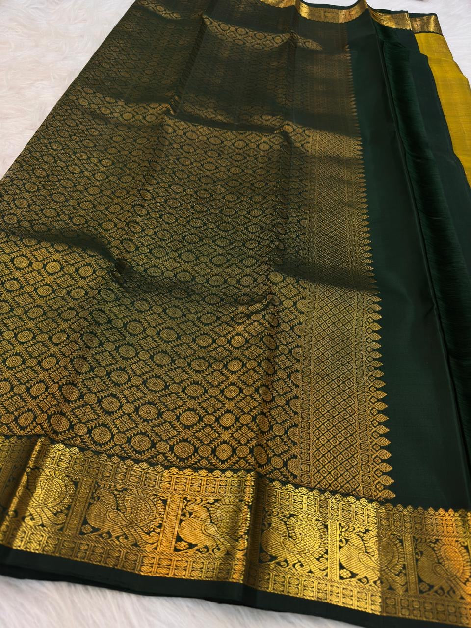 Handwoven zari paisley butta motif on Antique Mustard Gold silk.