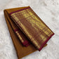 Close view of Kamalam zari buttas on mustard-gold Kanchipuram silk.
