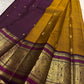 Mustard gold Kanchipuram silk saree with sorgavaasal mayil peacock motif detail