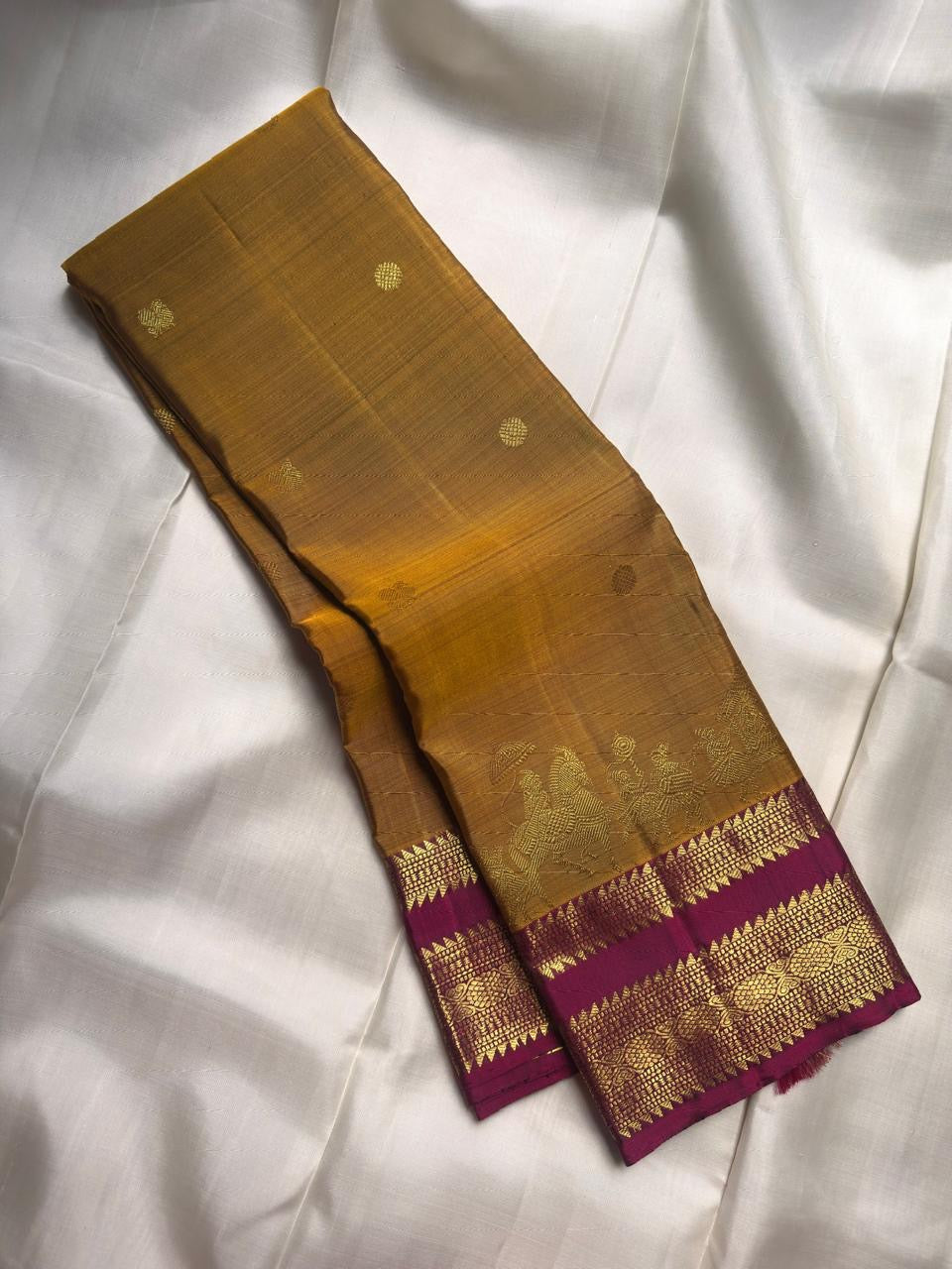 Handwoven Kanchipuram silk saree with antique gold zari wedding procession border