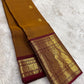 Mustard-gold Pure Silk Kanchipuram Zari Kattam saree.