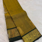 Antique Mustard Gold silk saree with handwoven zari paisley buttas.