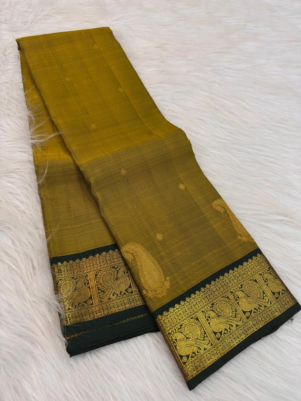 Antique Mustard Gold silk saree with handwoven zari paisley buttas.