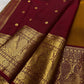 Mustard-gold Pure Silk Kanchipuram saree with gold zari and Arakku border.