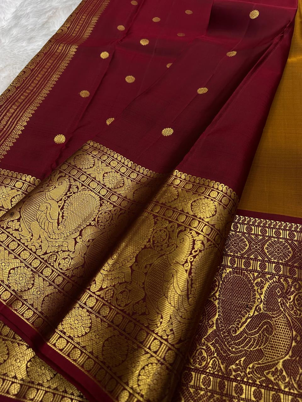 Mustard-gold Pure Silk Kanchipuram saree with gold zari and Arakku border.