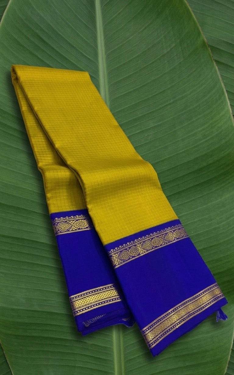 Mustard and royal blue handwoven KanchiPattu silk saree with zari kattam body and korvai border on banana leaf — Idam Living