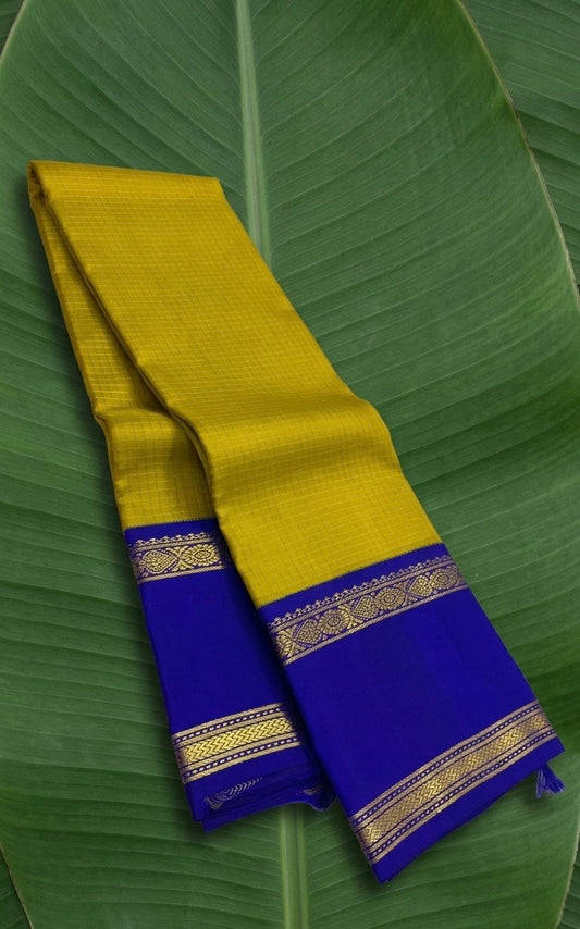 Mustard and royal blue handwoven KanchiPattu silk saree with zari kattam body and korvai border on banana leaf — Idam Living