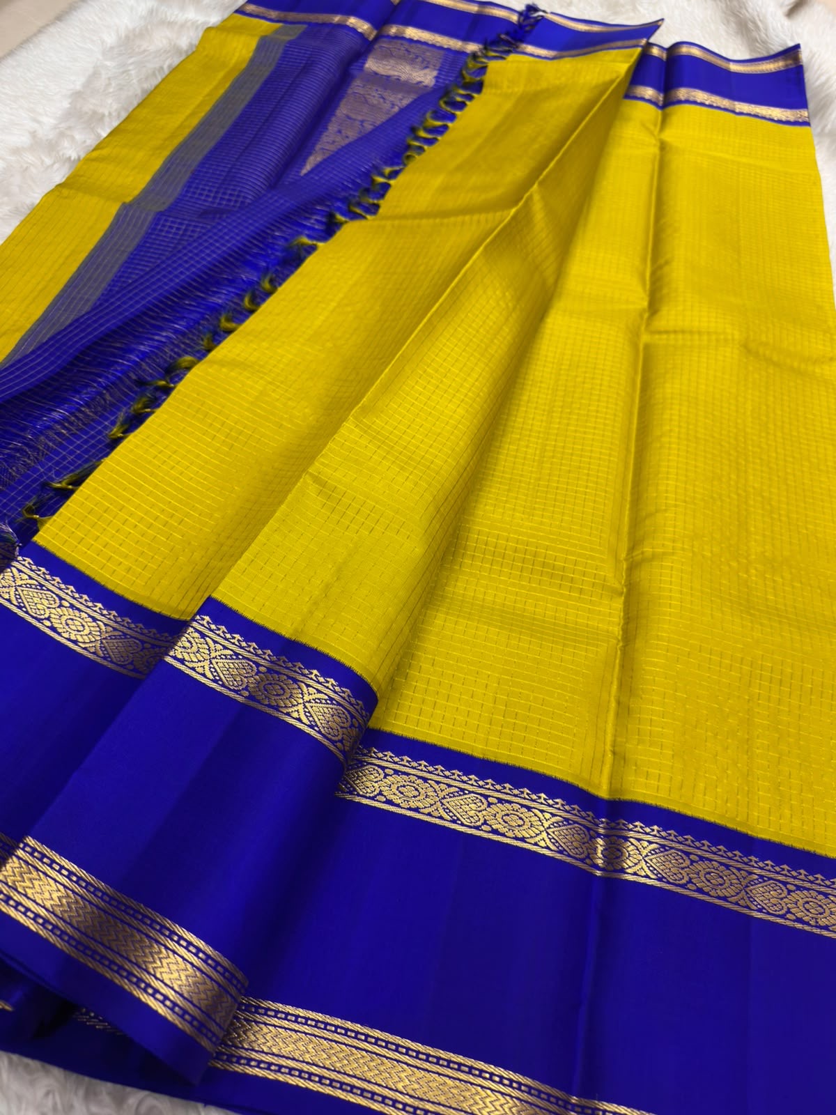 Royal blue pallu with layered gold zari bands on mustard KanchiPattu korvai silk saree — Idam Living