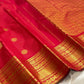 Kumkum red Kanchipuram silk saree showing fine gold zari kattam checks and Mayil Chakram buttas