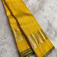 Full view of canary yellow handwoven Kanchipuram pure silk saree with zari kattam body — Idam Living