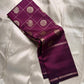 Partially draped plum Pure Kanchipuram silk saree with zari checked body, scattered woven motifs, and slim zari border.