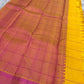 Contrasting pink zari woven pallu with geometric pattern beside mustard yellow checked saree, available in the USA