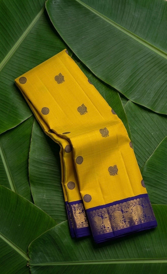 Mustard yellow handwoven Kanchipuram pure silk saree with silk thread mayil butta and royal blue korvai border — Idam Living