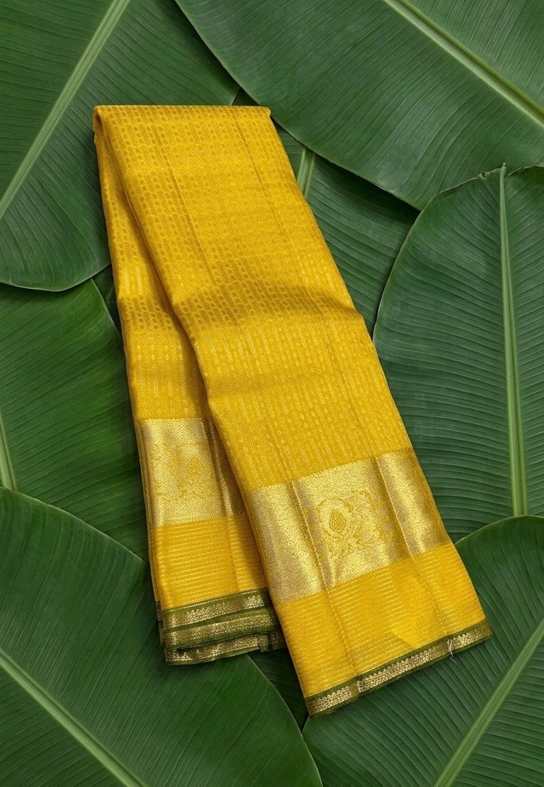 Canary yellow handwoven Kanchipuram pure silk saree with dense zari kattam body and forest green korvai border — Idam Living