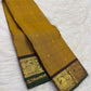 Mustard Yellow Handwoven Pure Silk Kanjivaram Zari Kattam Saree with Coffee Brown Peacock Border – front full drape view