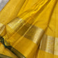 Gold zari kattam body close-up on canary yellow Kanchipuram pure silk saree — Idam Living