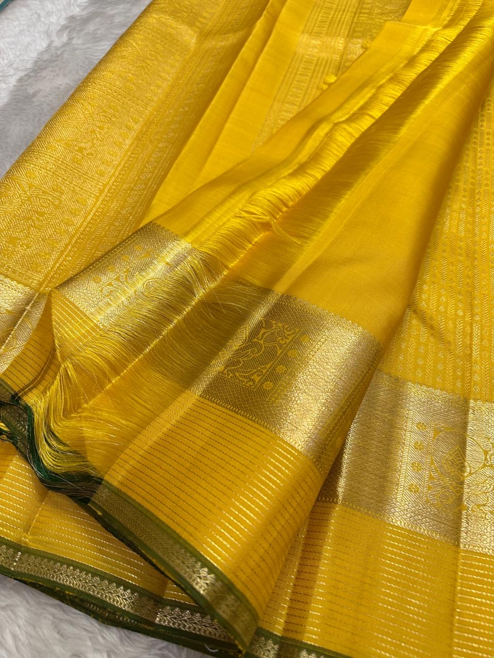 Gold zari kattam body close-up on canary yellow Kanchipuram pure silk saree — Idam Living