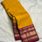 Mustard Yellow Handwoven Pure Silk Kanchipuram Saree with Pink Varisaipet Border