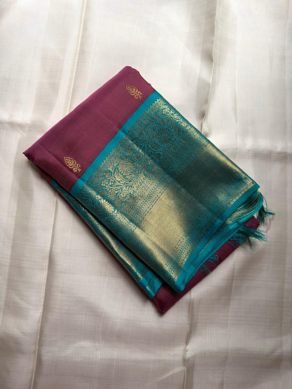 Muted Plum-Rose Pure Silk Kanchipuram Butta saree with Turquoise zari border