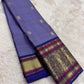 Mysterious purple Kanchipuram silk saree with ornate pallu and zari border – folded view