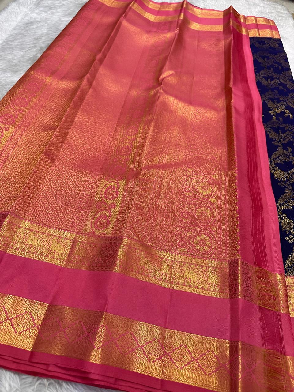 Midnight aubergine-violet Kanchipuram body with fine Zari Kattam texture and spaced traditional gold buttas.