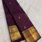 Naval Pazham plum pure silk Kanchipuram Butta saree, spread in pleats, with antique-gold border