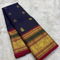 Handwoven navy blue Kancheepuram pure silk saree with gold zari Yaanai Ambari Butta and deep red Vanasringaram border