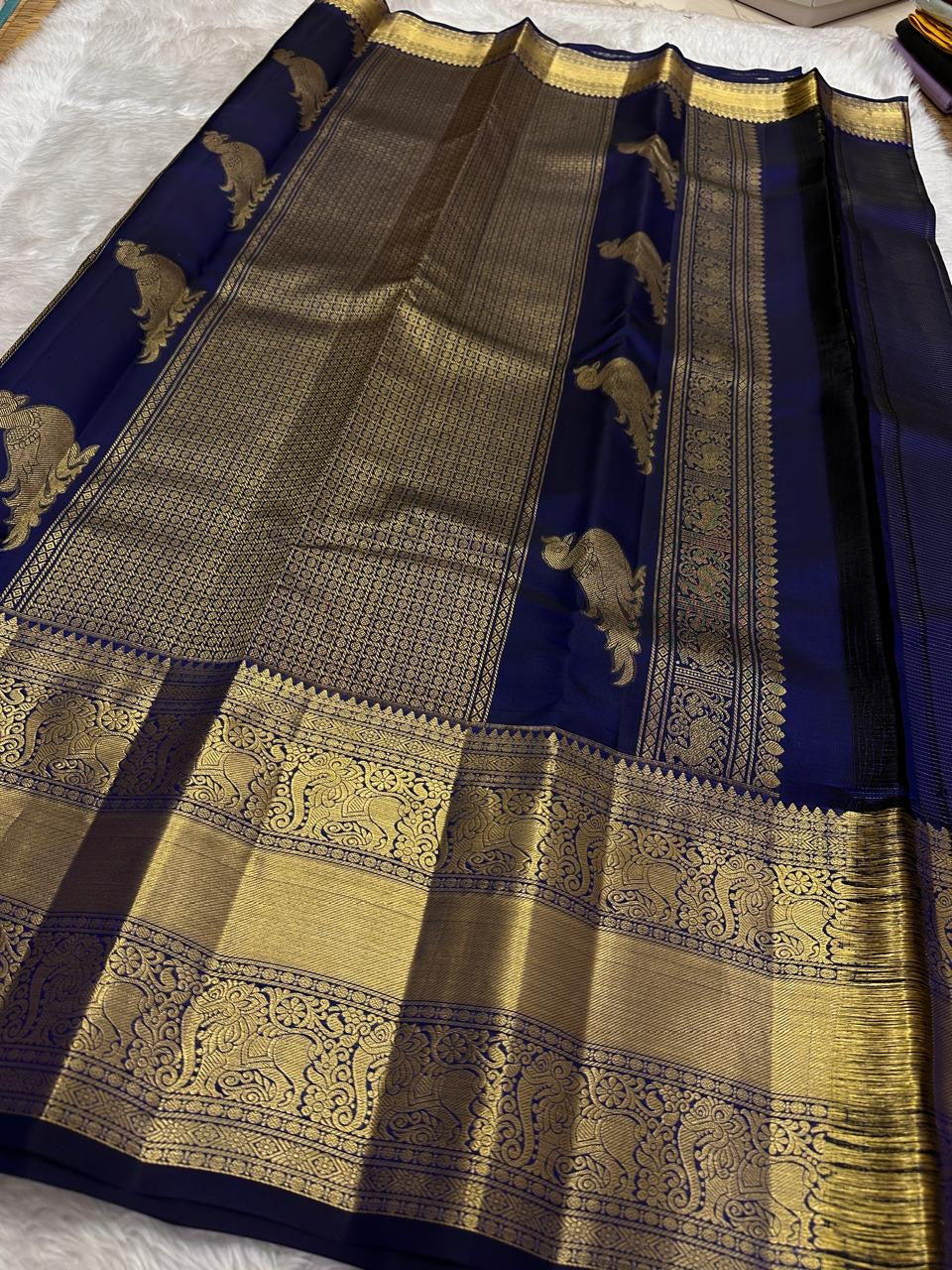 Navy blue Kancheepuram silk saree with Zari Kattam weave and ornate Yazhi border — Idam Living