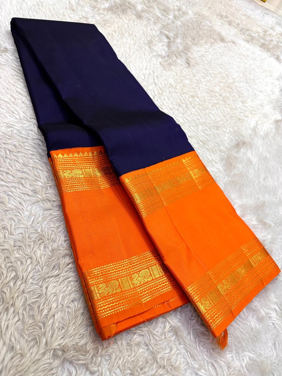 Navy blue Rettapet Kanjeevaram saree with orange border