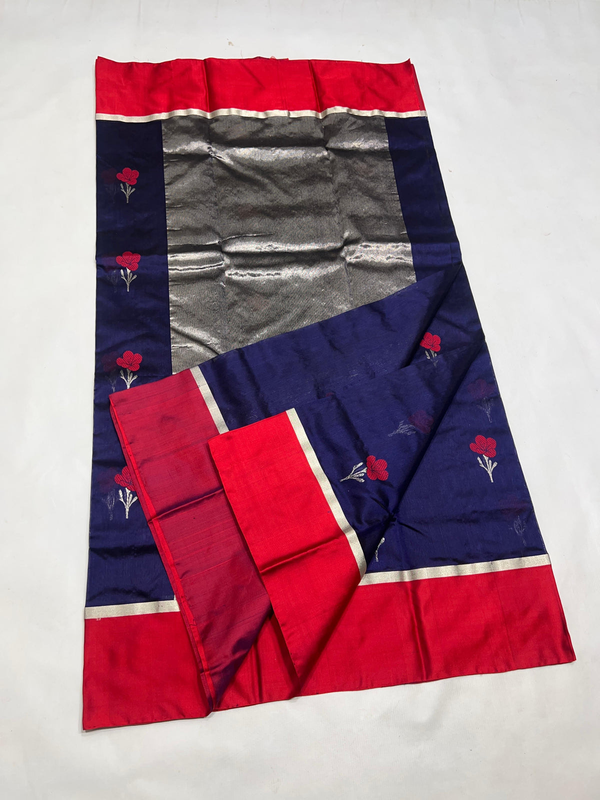 Neelam blue Chanderi saree showing red floral butta detail
