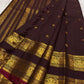 Ornate self-colour border of deep wine plum Kanjipuram saree with dense Maanga and Yaanai antique gold zari array