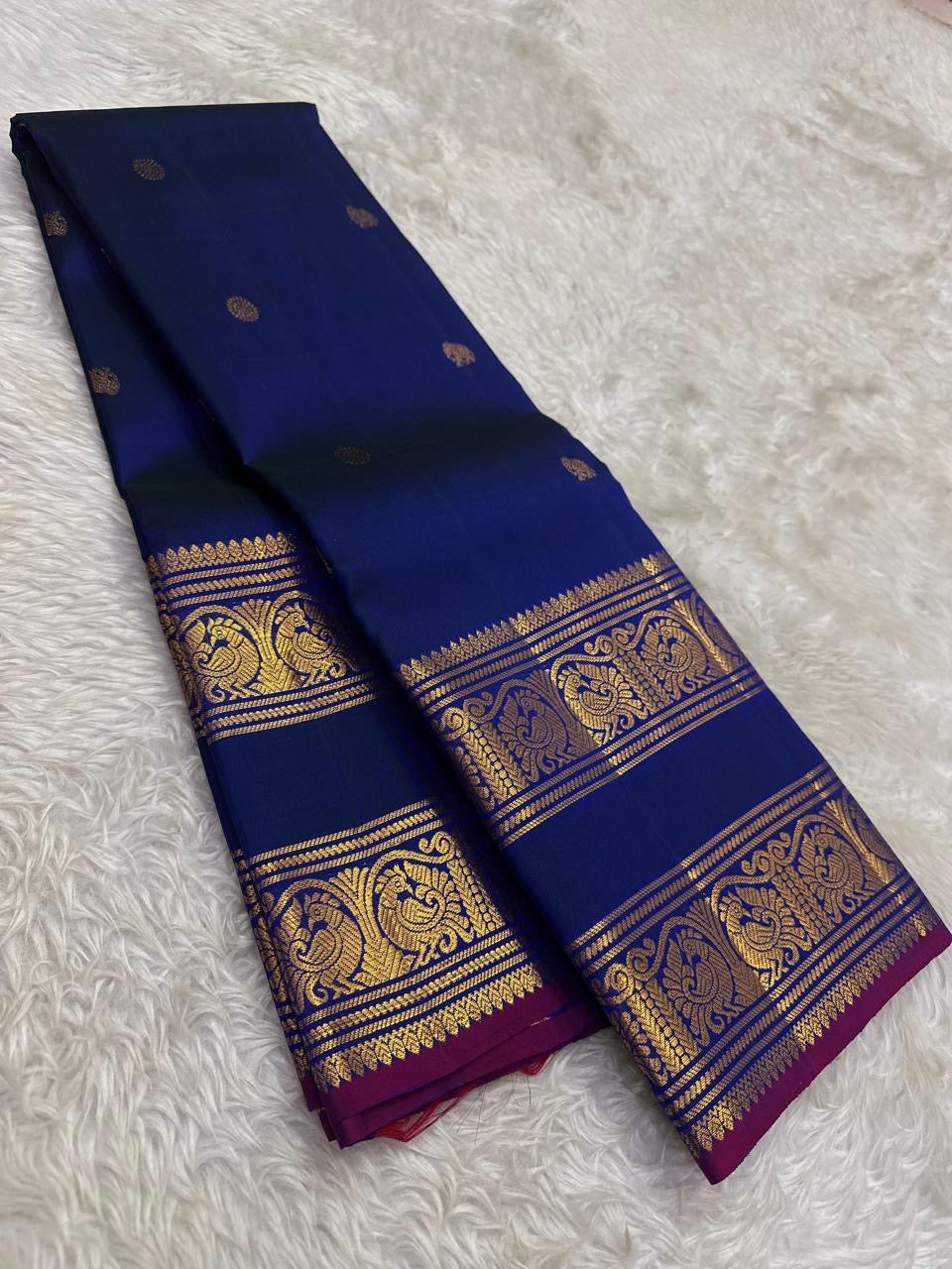 Handwoven pure silk Kanjipuram saree in navy blue with Rettapet Mayil Pavun butta and magenta Korvai Annam Mayil antique gold zari border Silk Mark certified
