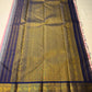 Full pallu layout of Kanchipuram silk saree in navy with antique gold zari woven field and tassels, available in the USA
