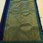 Teal-green silver zari striped border weave close-up