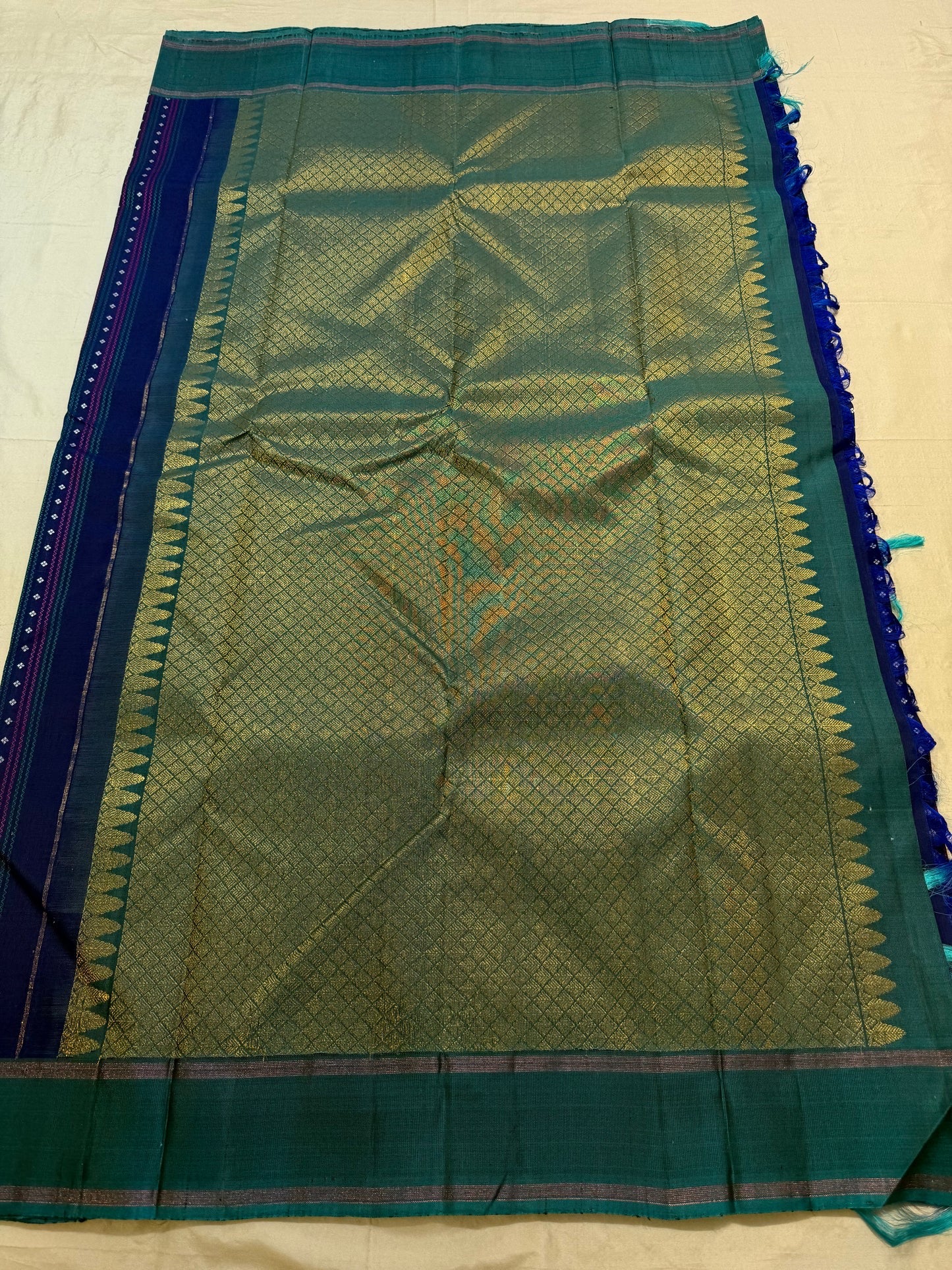 Teal-green silver zari striped border weave close-up