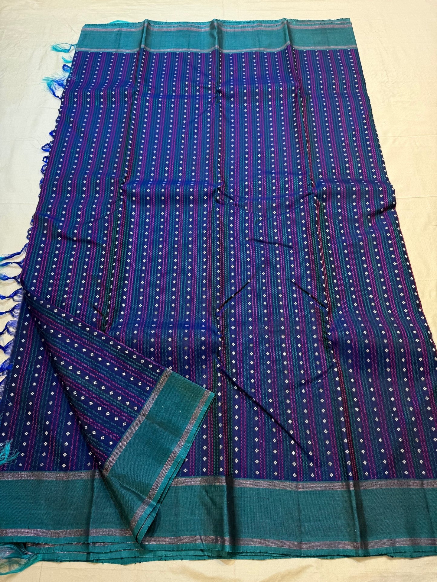 Navy handwoven pure silk Kanchi Pattu saree with teal jewel-tone butta work — Idam Living