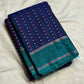 Teal-green silver zari pallu detail on navy Kanchi Pattu saree